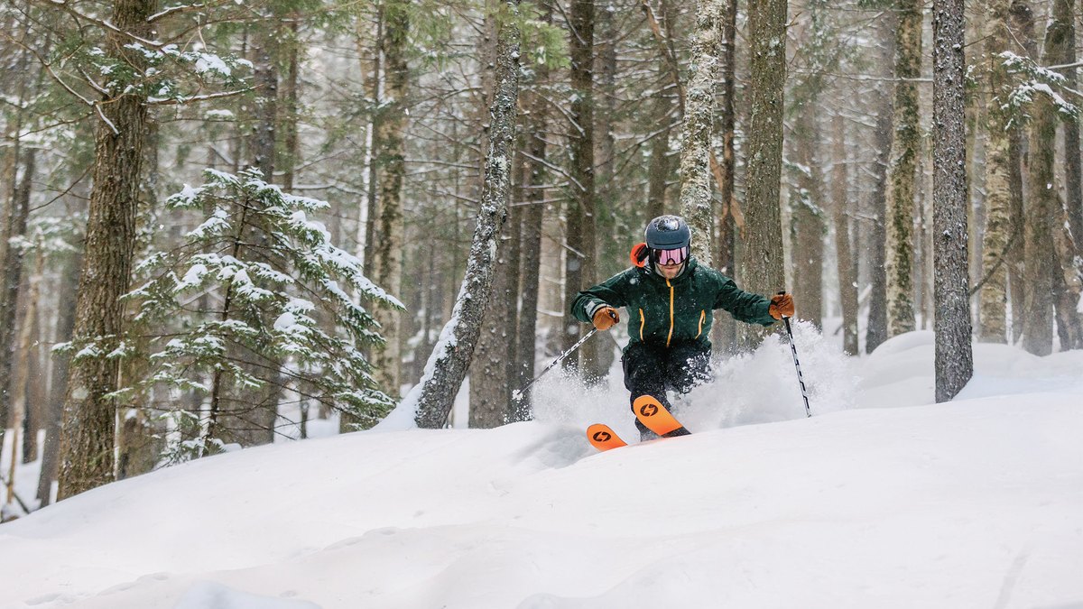 A skier travels through snow-covered trees at Loon Mountain Resort.